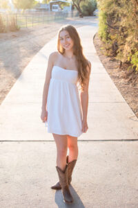 senior grad girl in white dress at nature preserve