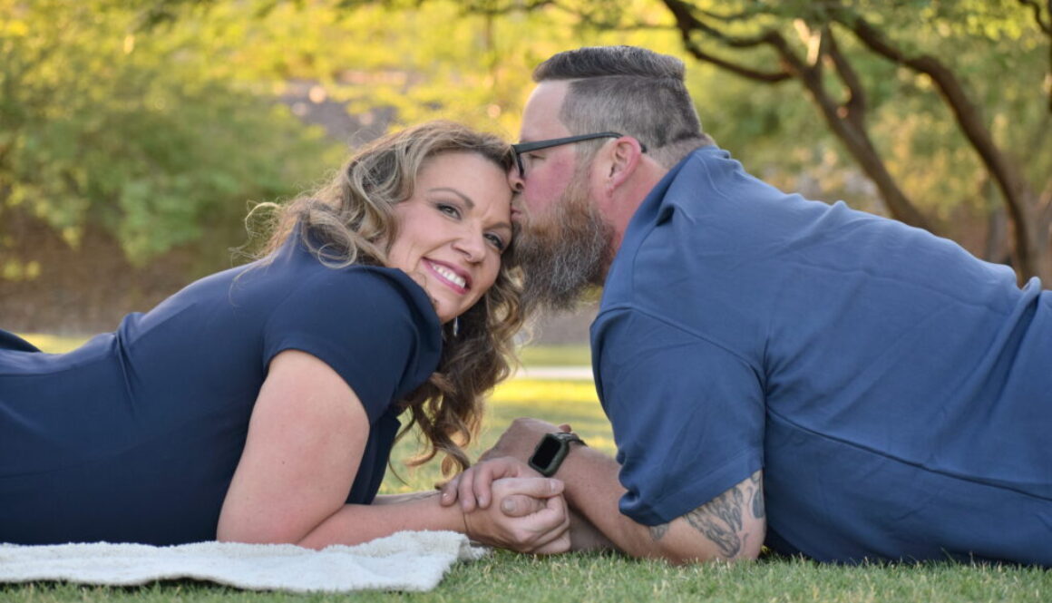 Cute couple in blue man kissing womans head. Buckeye,AZ. Photo by amazing avondale photographer