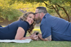 Cute couple in blue man kissing womans head. Buckeye,AZ. Photo by amazing avondale photographer