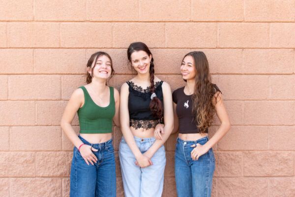 Photo of three teenage girl friends with jeans and crop tops on Senior Graduate Photographer