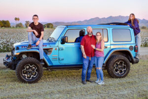 Family in cotton field with blue jeep in Buckeye, AZ