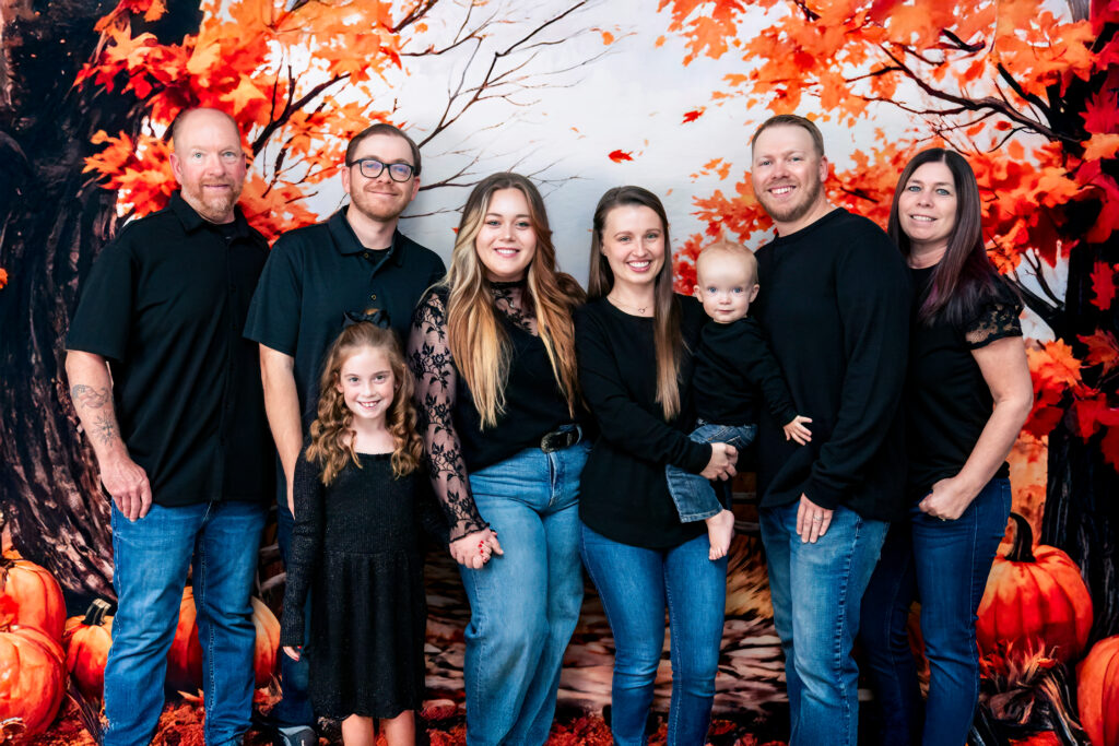 A heartfelt studio session in Phoenix featuring fall-inspired backdrops, Christmas scenes, and three generations. Perfect for families juggling busy schedules, football Sundays, and Arizona’s lack of fall leaves.