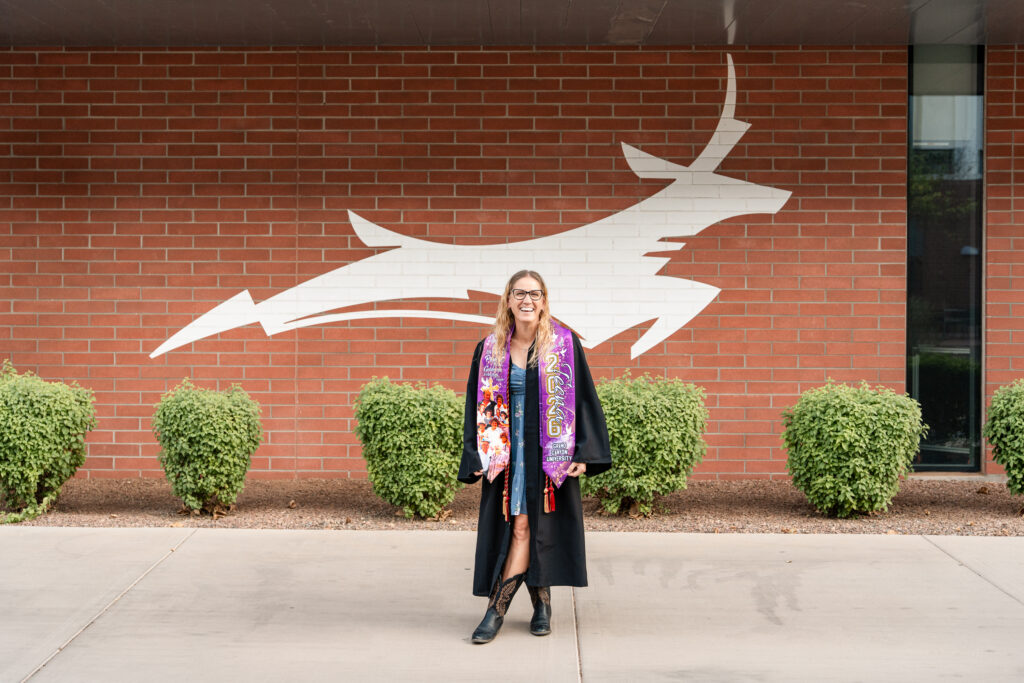 Woman in her 50s celebrating her bachelor's degree from Grand Canyon University